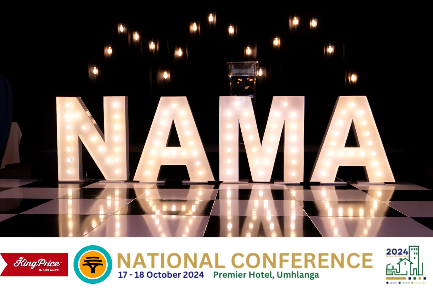 Illuminated NAMA letters on stage at a national conference